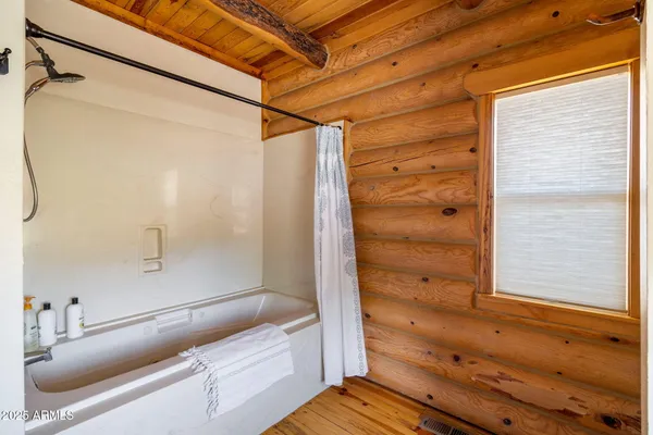 a bed room with a bed and a window