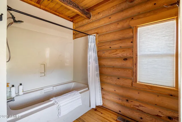 a bed room with a bed and a window