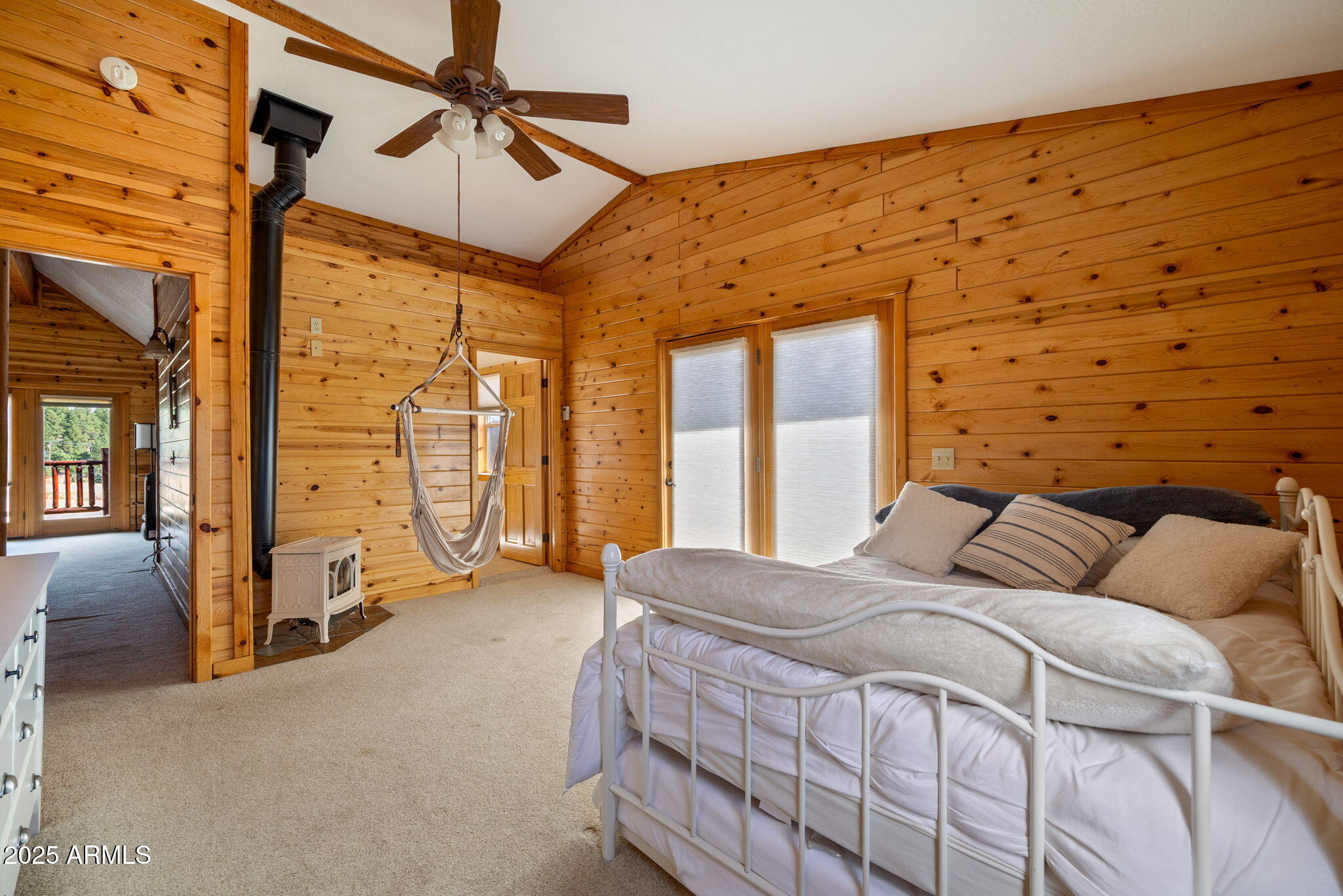 100 Main Street Greer, AZ 85925 - Photo 29 of 63 a bedroom with a bed couch and a large window