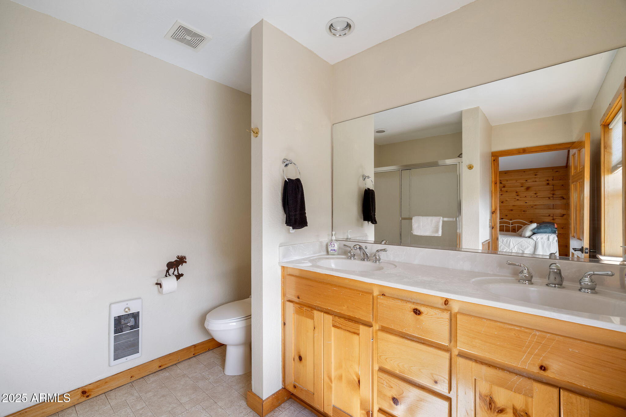 100 Main Street Greer, AZ 85925 - Photo 31 of 63 a bathroom with a granite countertop sink mirror vanity and toilet