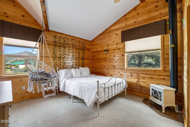 a bedroom with furniture and a window
