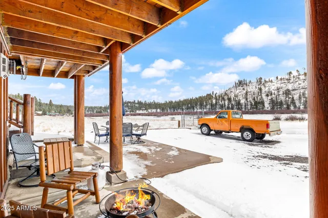 a kitchen with stainless steel appliances granite countertop a refrigerator a stove and a sink with wooden floor