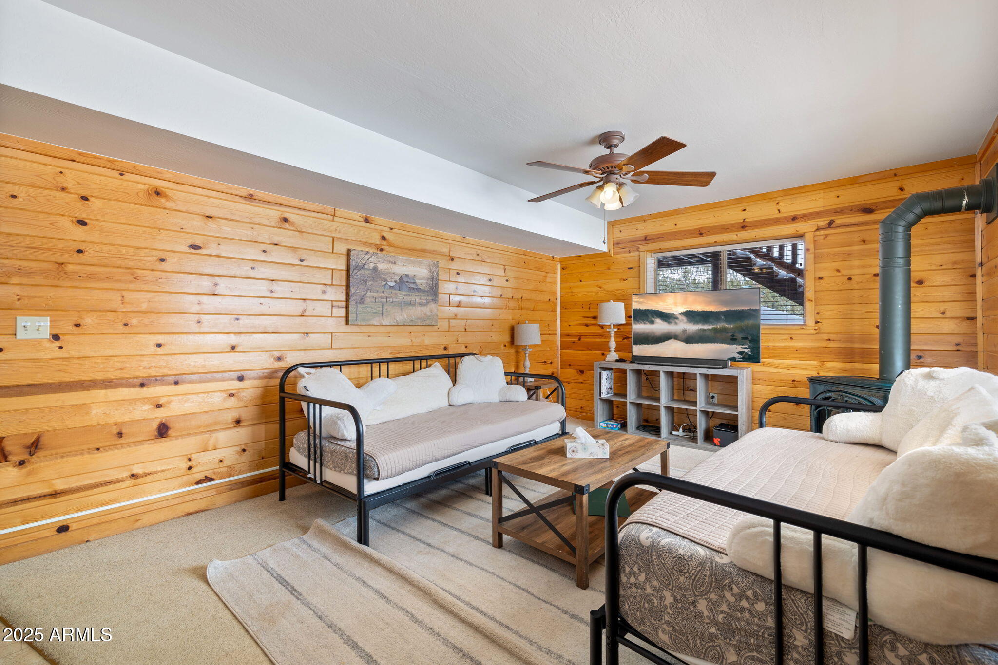 100 Main Street Greer, AZ 85925 - Photo 37 of 63 a bedroom with furniture and a window