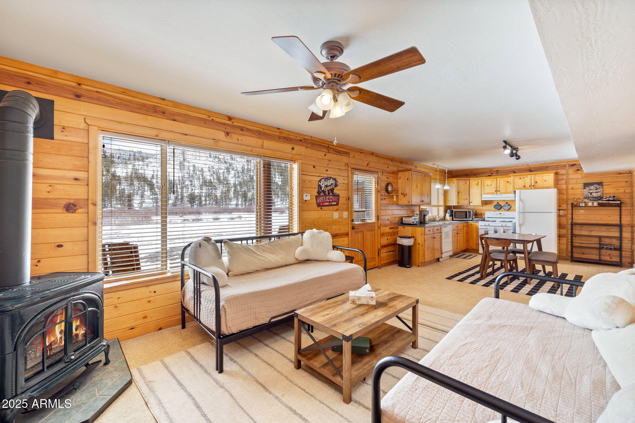 100 Main Street Greer, AZ 85925 - Photo 38 of 63 a living room with furniture and a large window