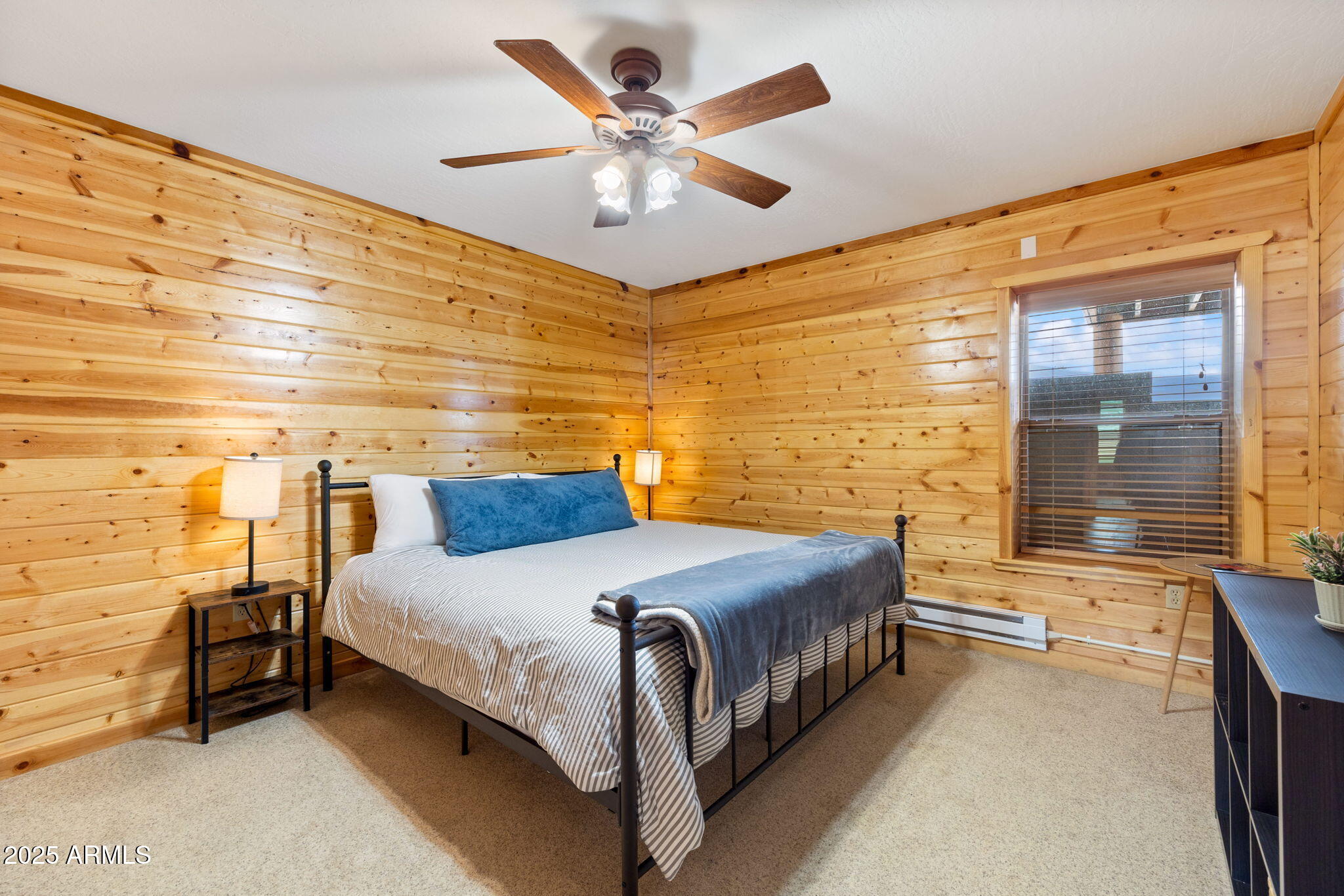 100 Main Street Greer, AZ 85925 - Photo 42 of 63 a bedroom with a bed and window
