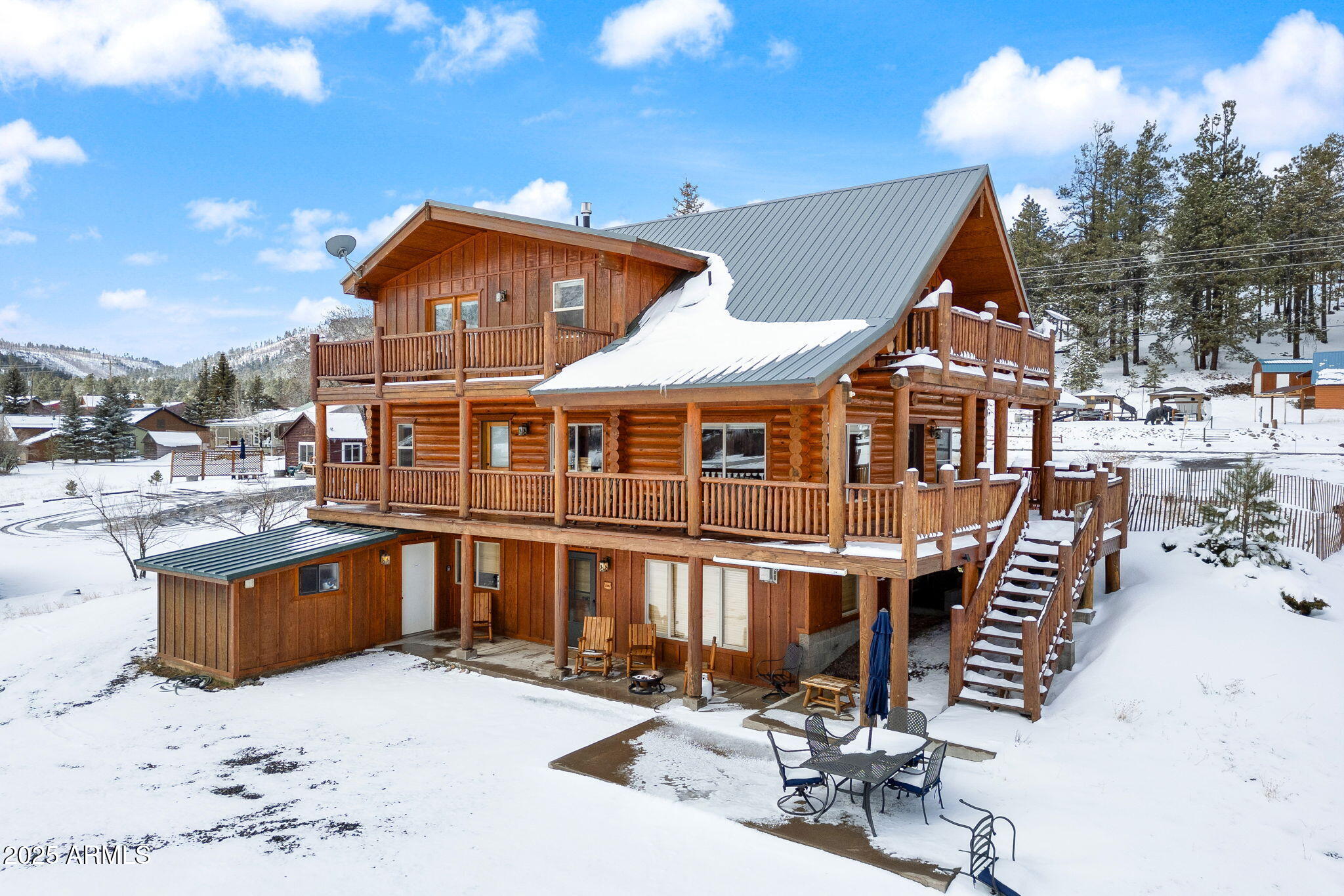 100 Main Street Greer, AZ 85925 - Photo 45 of 63 a view of a house with outdoor seating