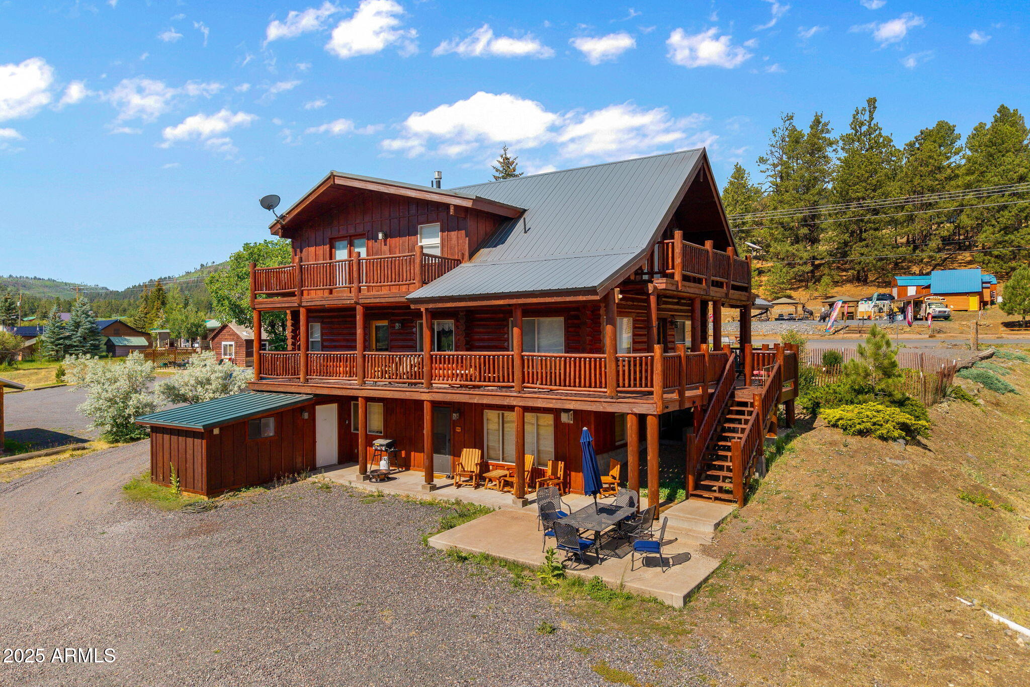 100 Main Street Greer, AZ 85925 - Photo 3 of 63 a front view of a house with sitting area