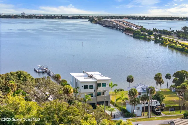 a terrace with outdoor seating and city view