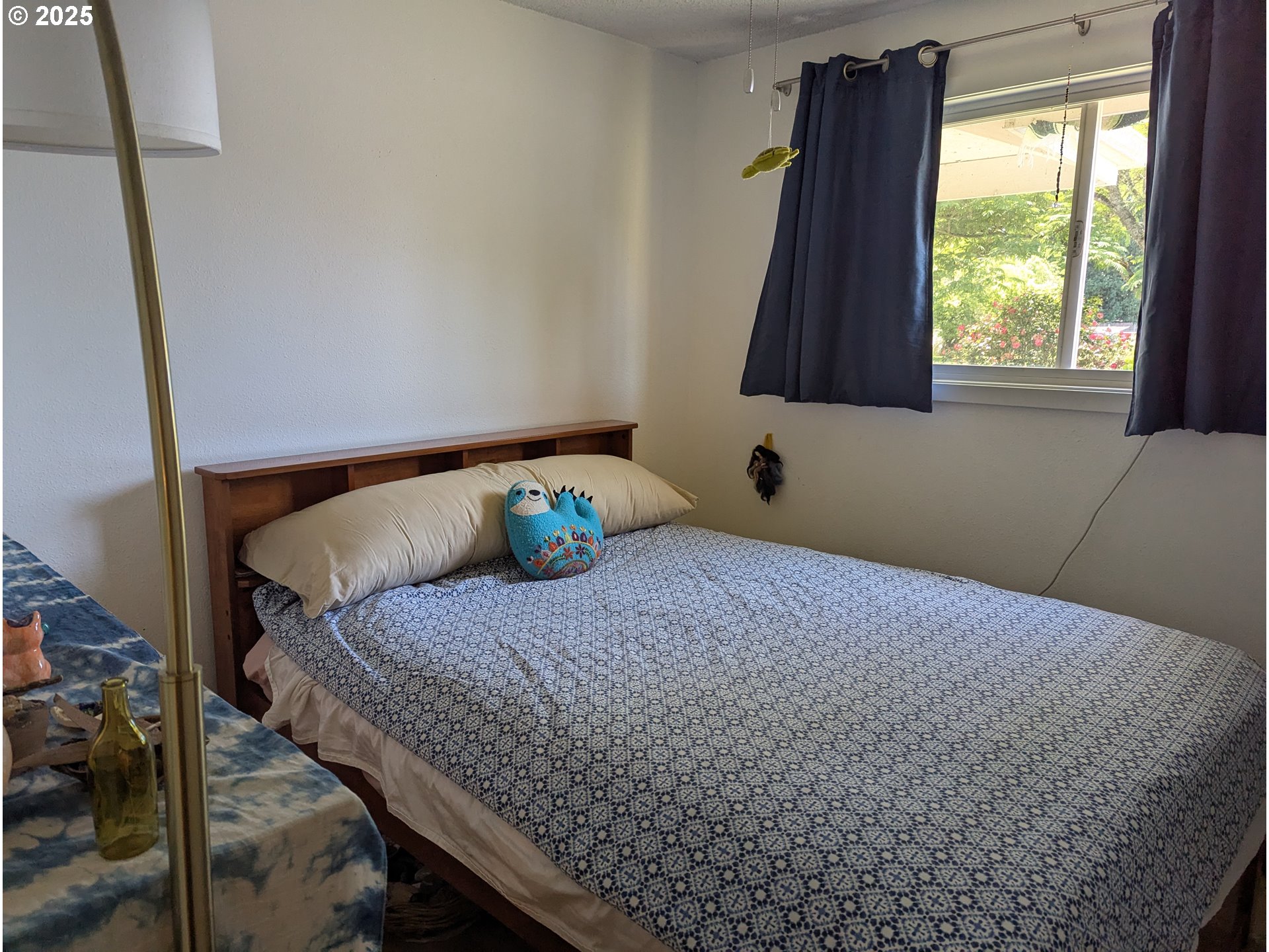3155 Northeast Lancaster Street Corvallis, OR 97330 - Photo 17 of 27 a bedroom with a bed and a window