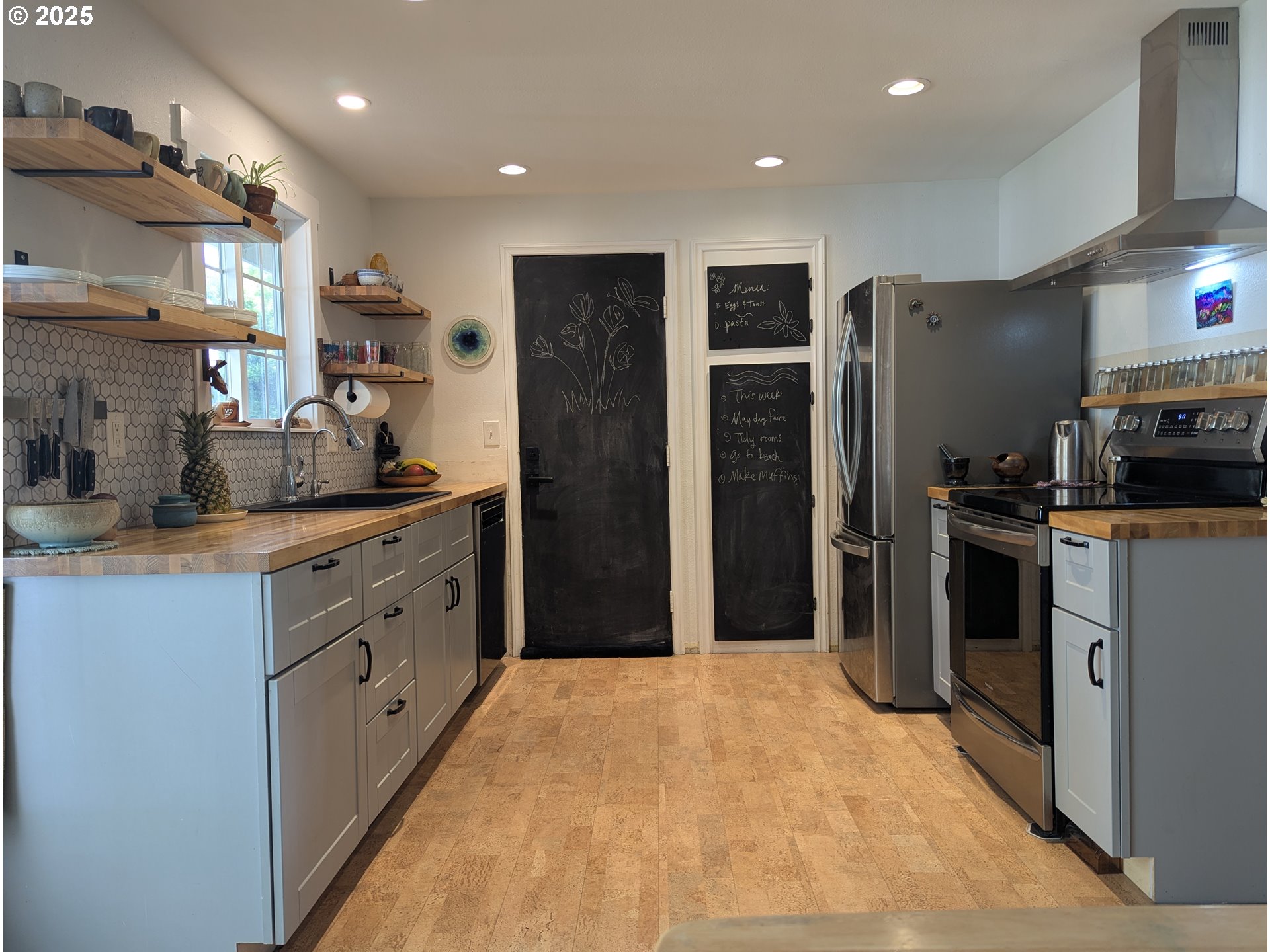 3155 Northeast Lancaster Street Corvallis, OR 97330 - Photo 9 of 27 a kitchen with stainless steel appliances granite countertop a refrigerator and a stove top oven