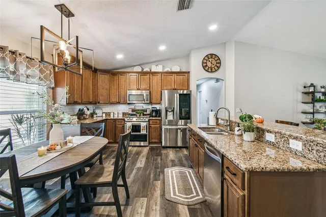 a view of roof deck with a barbeque and wooden stairs