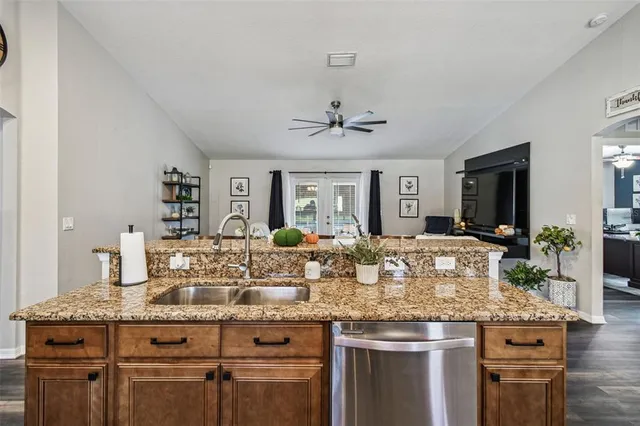 a swimming pool with outdoor seating and yard