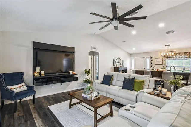 a view of a workspace with furniture window and wooden floor