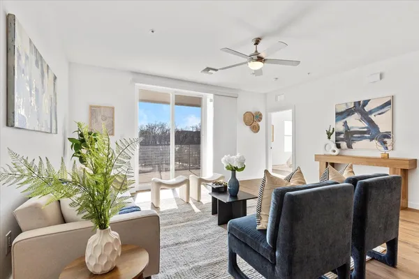 a living room with furniture and a large window
