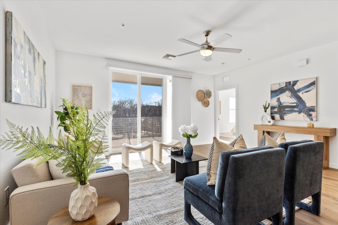 4801 Springdale Road, Unit 1107 Austin, TX 78723 - Photo 12 of 40 Living room with wood finished floors and ceiling fan