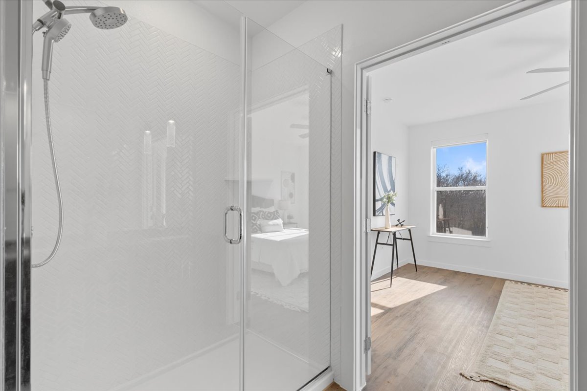 4801 Springdale Road, Unit 1107 Austin, TX 78723 - Photo 17 of 40 a bathroom with a glass shower door