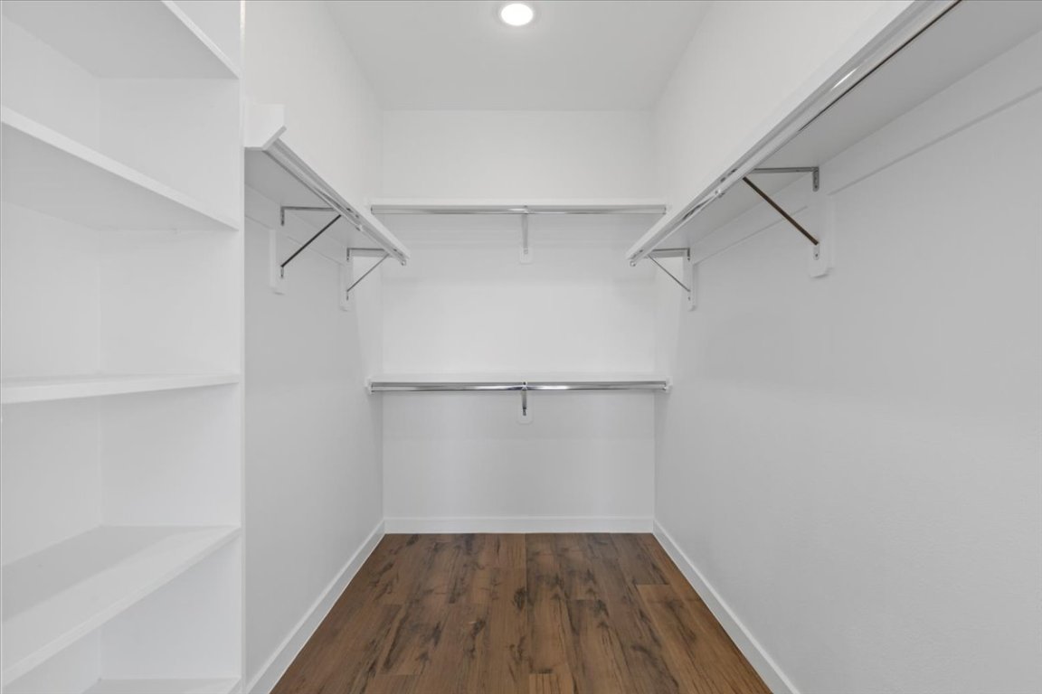 4801 Springdale Road, Unit 1107 Austin, TX 78723 - Photo 18 of 40 Spacious closet featuring dark wood-style flooring