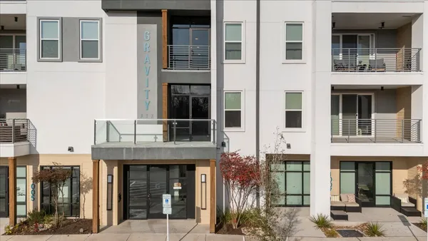 front view of a brick house with a large windows