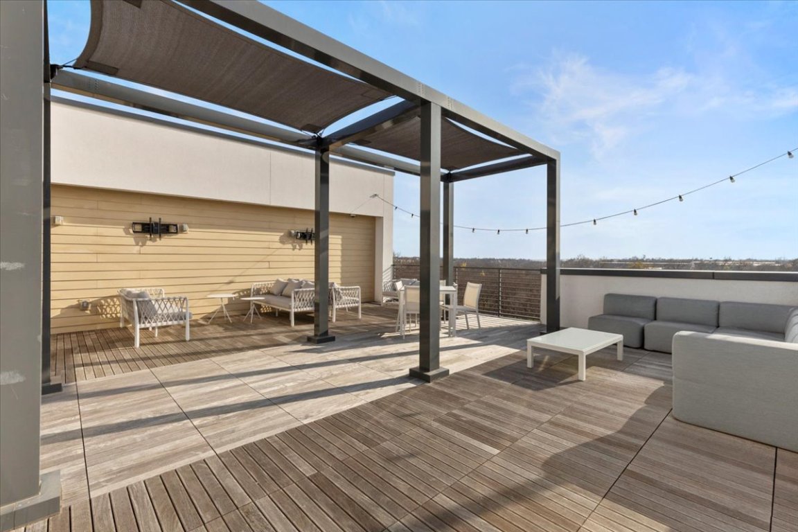 4801 Springdale Road, Unit 1107 Austin, TX 78723 - Photo 31 of 40 Wooden deck featuring an outdoor hangout area