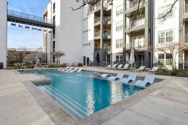a view of pool with outdoor seating
