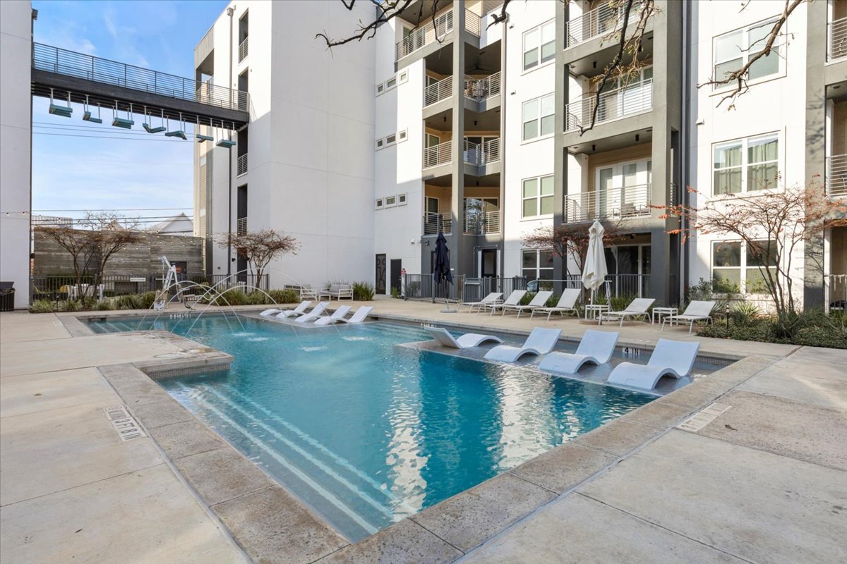 4801 Springdale Road, Unit 1107 Austin, TX 78723 - Photo 34 of 40 a view of pool with outdoor seating