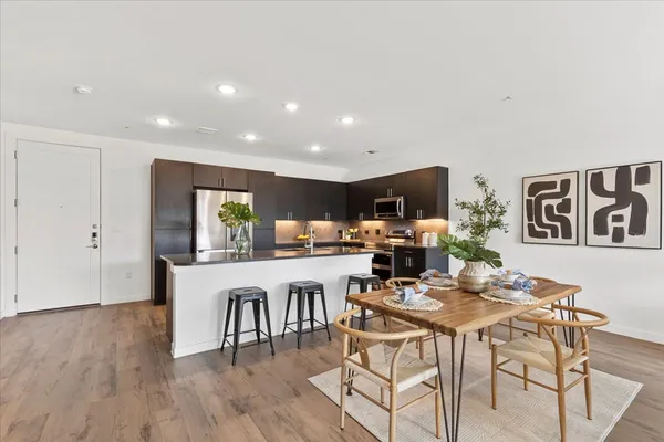a view of a dining room with furniture window and wooden floor