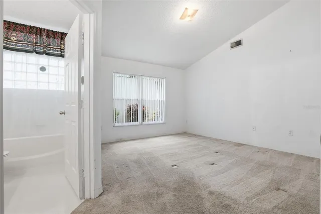 an empty room with windows