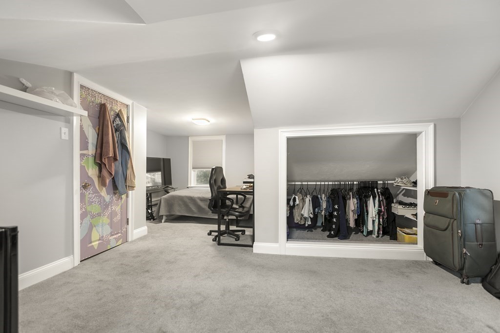 61 Patten Drive Marlborough, MA 01752 - Photo 13 of 20 a living room with furniture a flat screen tv and a large window