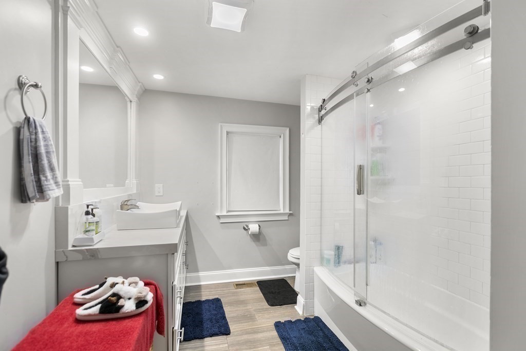 61 Patten Drive Marlborough, MA 01752 - Photo 8 of 20 a bathroom with a bathtub shower sink and toilet