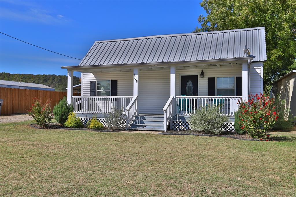 105 Pine Street Gordon, TX 76453 - Photo 1 of 1 a front view of a house having yard