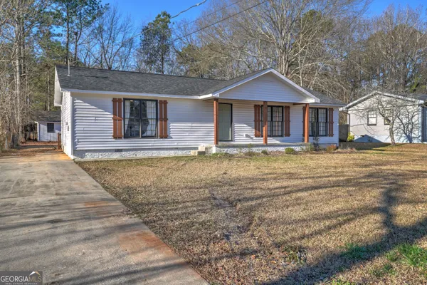 a front view of a house with a yard