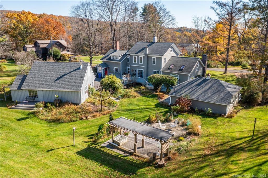 a aerial view of a house with swimming pool garden and patio