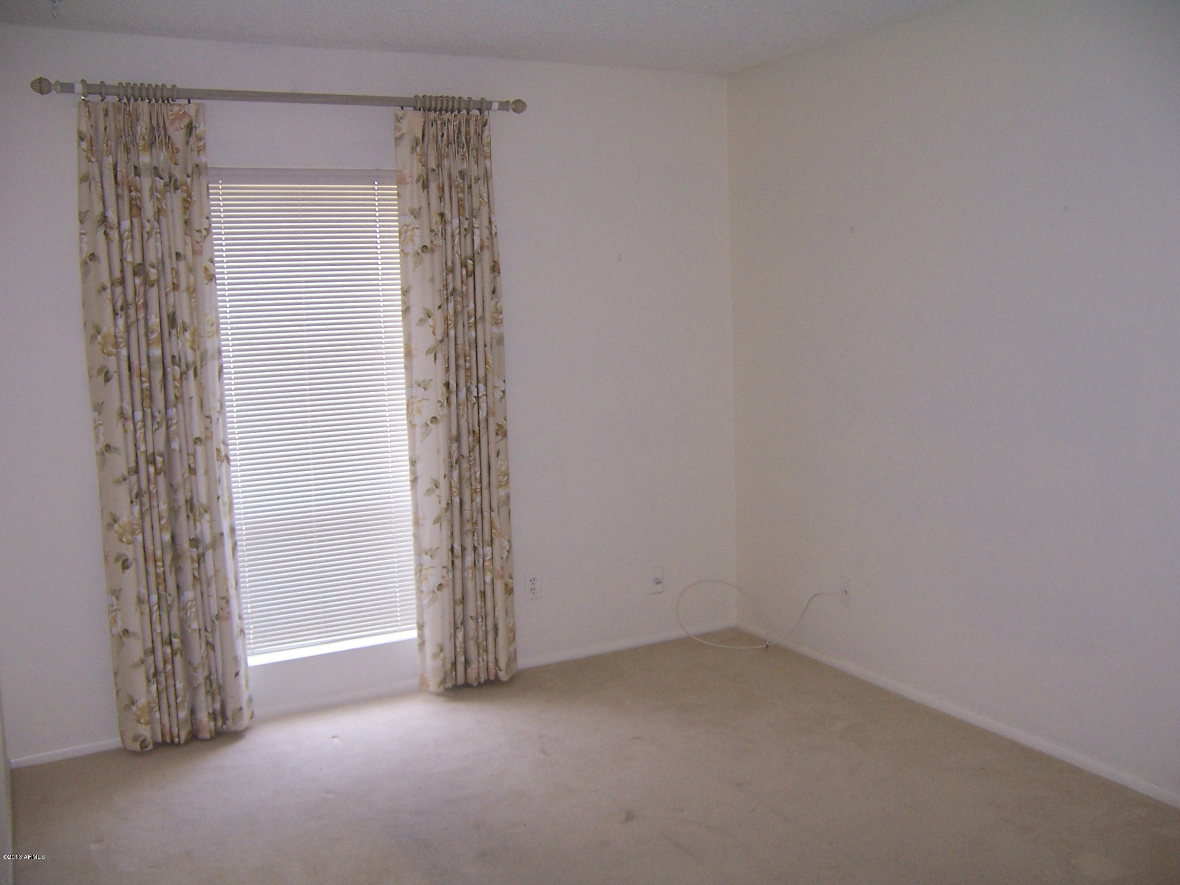 548 East Calavar Road Phoenix, AZ 85022 - Photo 12 of 32 a view of an empty room with a window