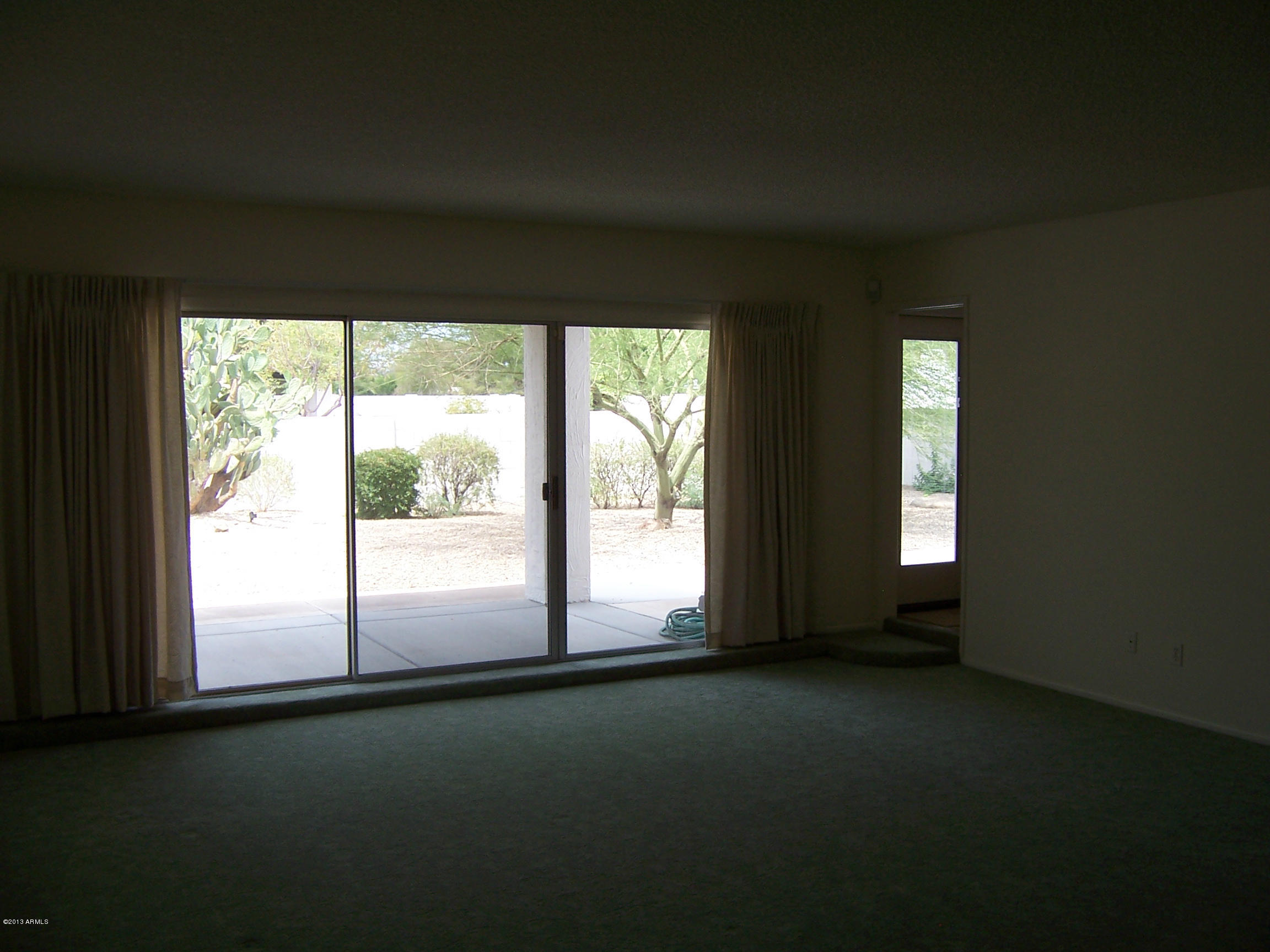 548 East Calavar Road Phoenix, AZ 85022 - Photo 4 of 32 a view of empty room with window