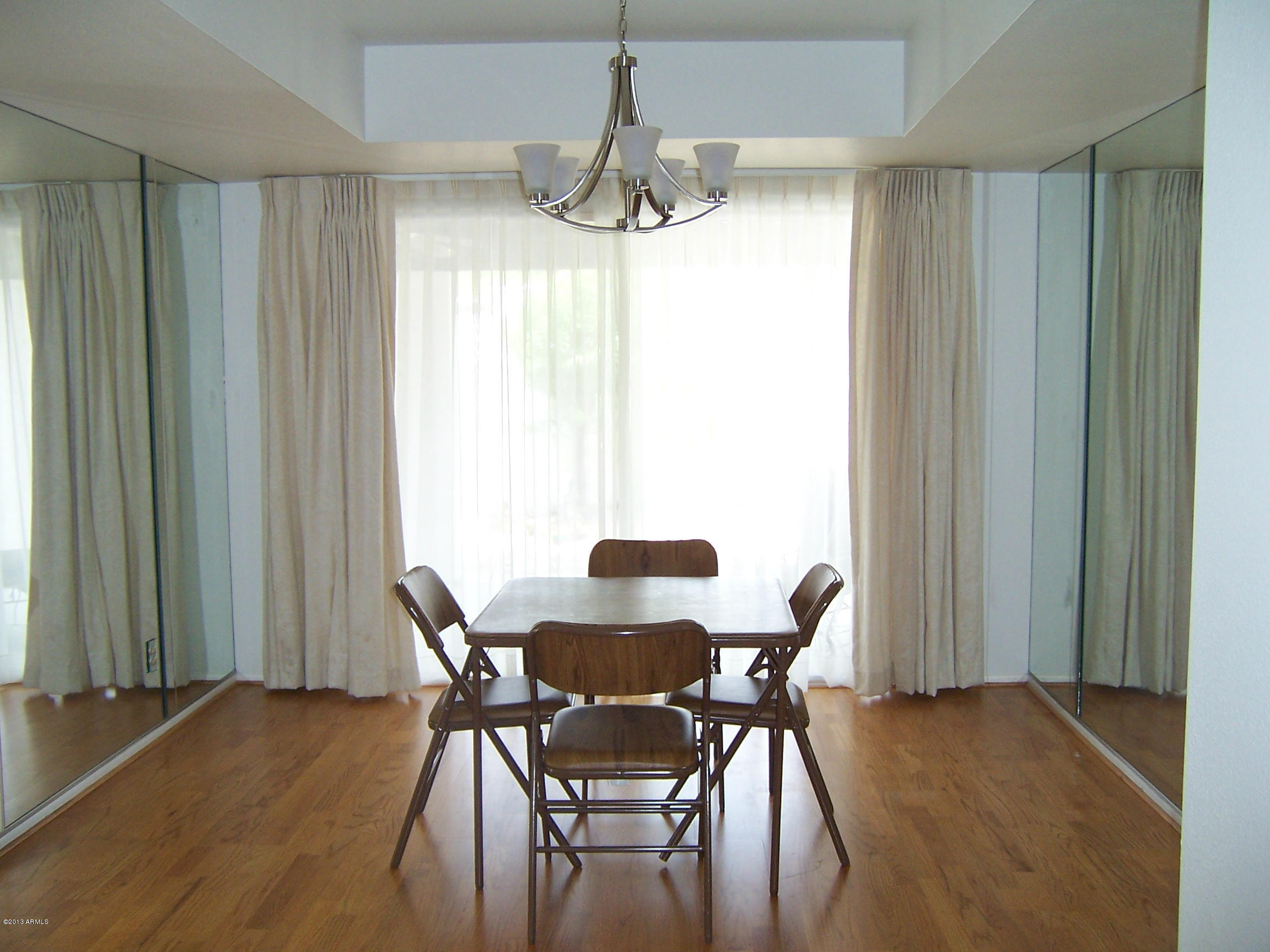 548 East Calavar Road Phoenix, AZ 85022 - Photo 5 of 32 a view of a dining room with furniture window and outside view
