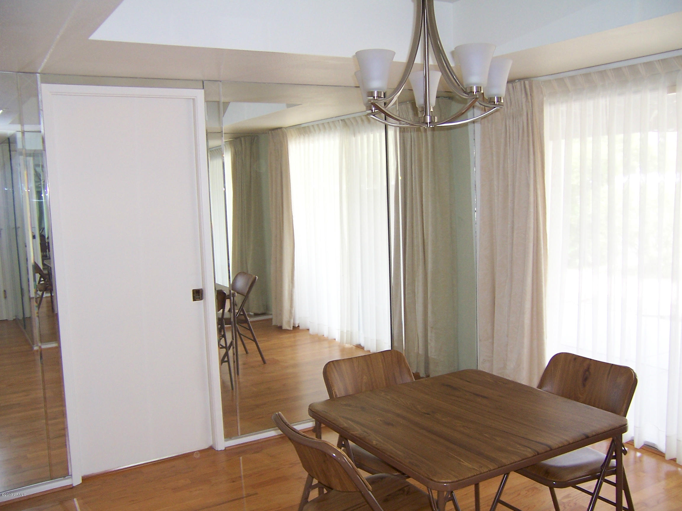 548 East Calavar Road Phoenix, AZ 85022 - Photo 6 of 32 a living room with furniture and a chandelier
