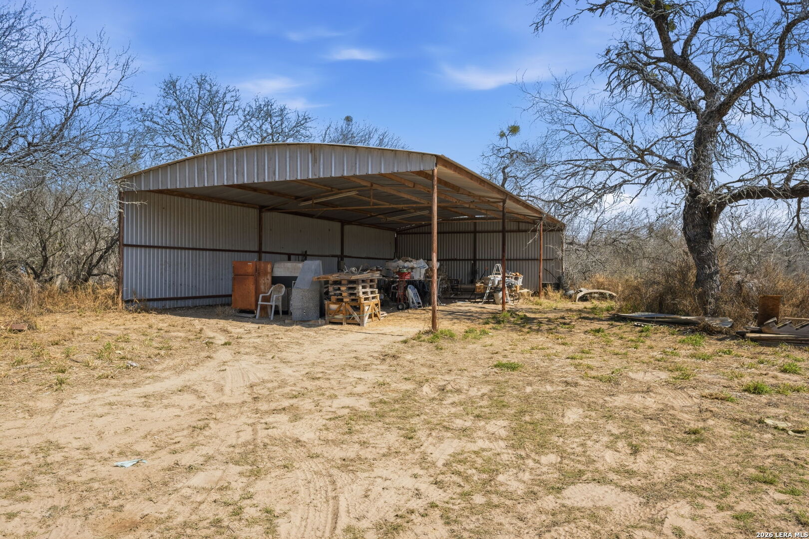 1150 Bruce Road Poteet, TX 78065 - Photo 33 of 33 a view of a house with backyard and sitting area