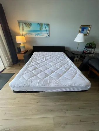 a bedroom with a bed and dresser