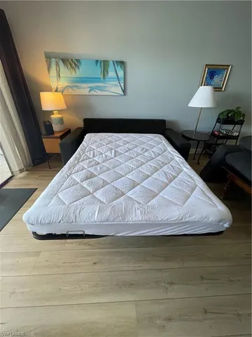 a bedroom with a bed and dresser