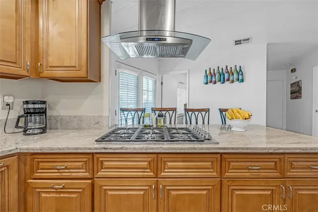 a kitchen with granite countertop stainless steel appliances granite countertop a sink and cabinets