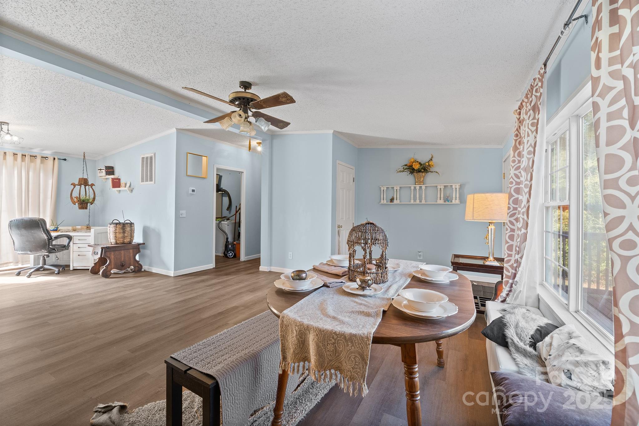 10483 Troutman Road Midland, NC 28107 - Photo 5 of 21 a view of a dining room with furniture and chandelier