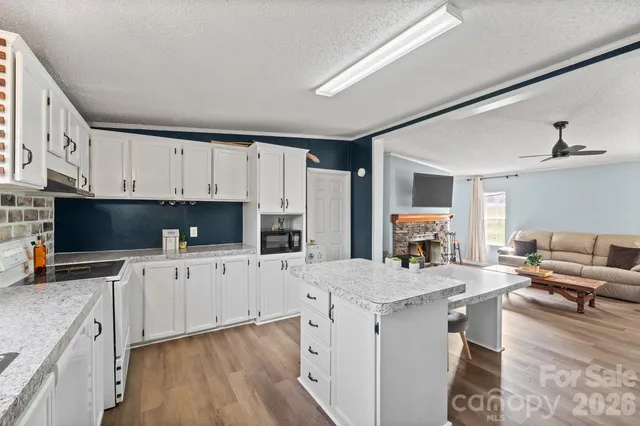 a kitchen with a sink stove and refrigerator