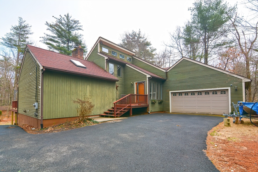 72 Allen Road Sturbridge, MA 01566 - Photo 1 of 40 a view of a house with a yard and garage