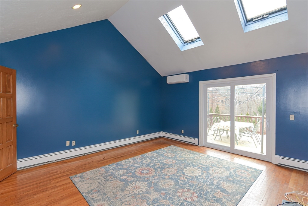72 Allen Road Sturbridge, MA 01566 - Photo 16 of 40 an empty room with wooden floor and windows