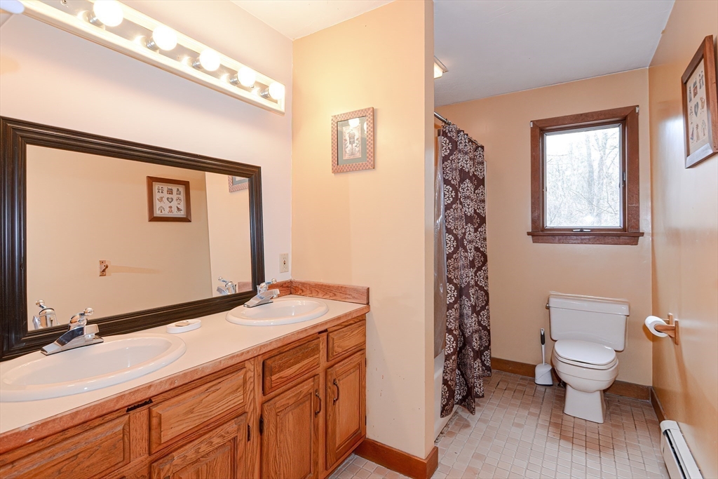 72 Allen Road Sturbridge, MA 01566 - Photo 26 of 40 a bathroom with a sink a toilet and a shower