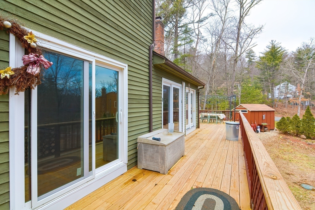72 Allen Road Sturbridge, MA 01566 - Photo 35 of 40 a view of a patio with a table and chairs