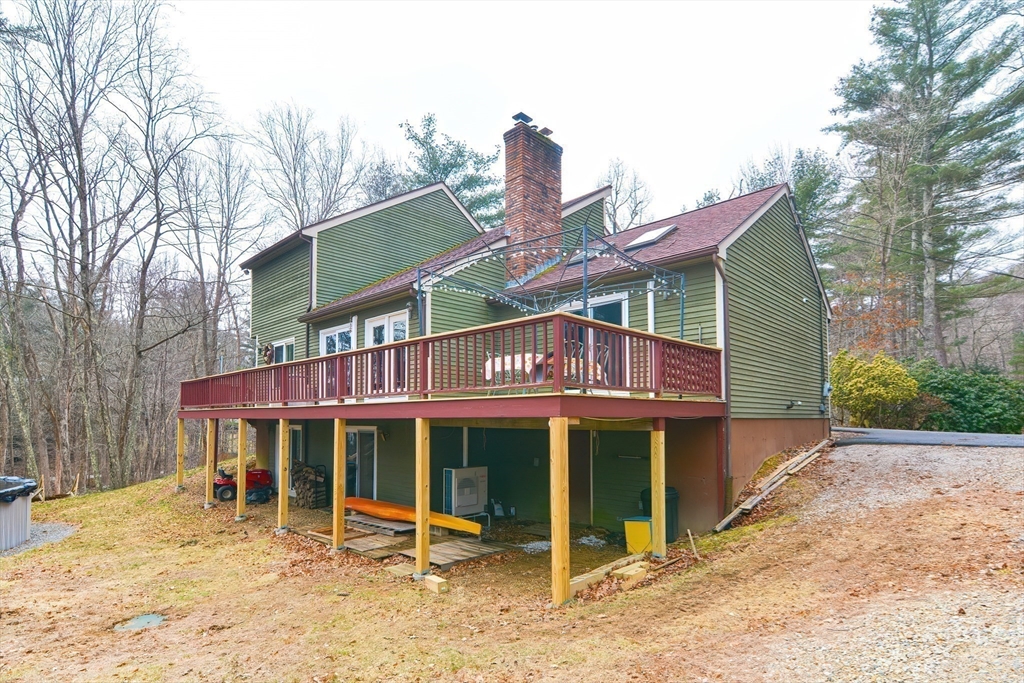 72 Allen Road Sturbridge, MA 01566 - Photo 37 of 40 a view of a house with a yard and wooden fence