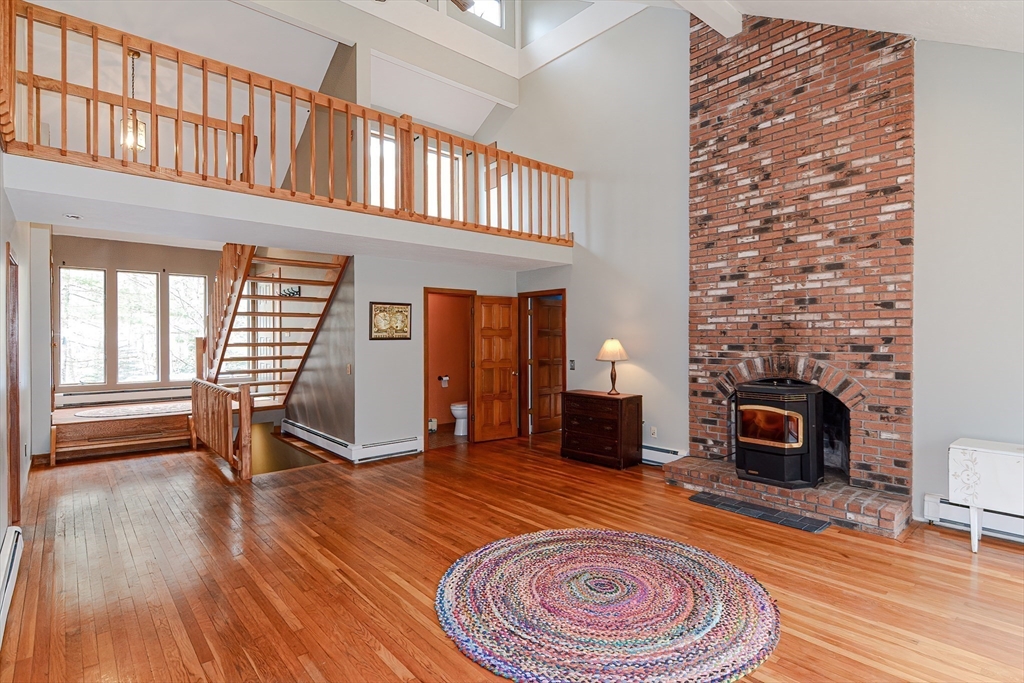 72 Allen Road Sturbridge, MA 01566 - Photo 9 of 40 a living room with furniture and a fireplace