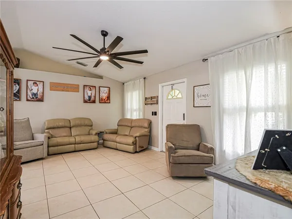 a living room with furniture and a window