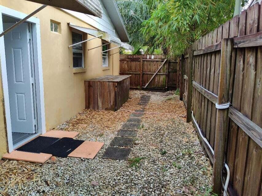 1951 Kathy Lane, Unit B Juno Ridge, FL 33408 - Photo 2 of 10 Side ent